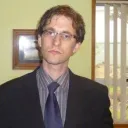 Ed Scriver, in a dark suit and tie